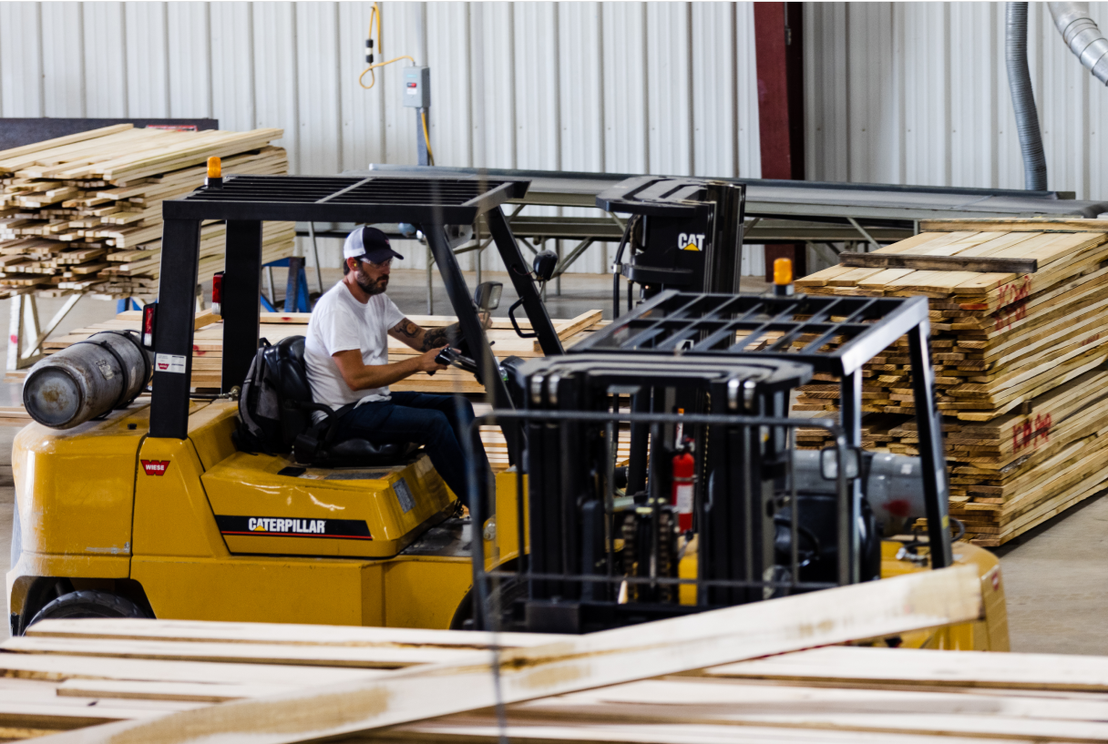 Forklift moving lumber